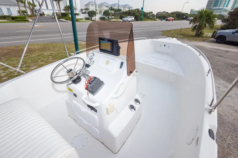 Slide: The Image of 2011 PROLINE 21 CC SE boat interior with steering console and navigation equipment. - 33