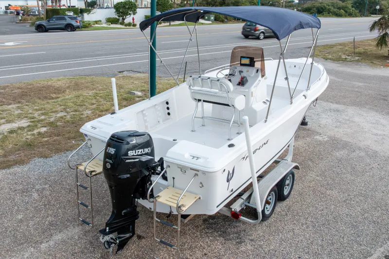 Slide: The Image of 2011 PROLINE 21 CC SE boat with Suzuki outboard motor on trailer. - 46