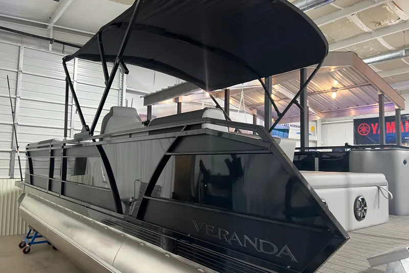 Slide: The Image of 2026 Veranda VR 265 VL pontoon boat with canopy in showroom. - 0