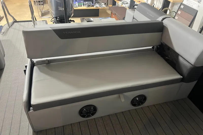 Slide: The Image of 2026 Veranda VR 265 VL boat interior with gray seating and integrated speakers. - 7
