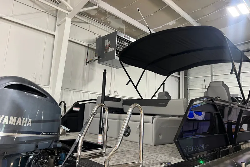 Slide: The Image of 2026 Veranda VR 265 VL pontoon boat with Yamaha engine in a garage setting. - 1
