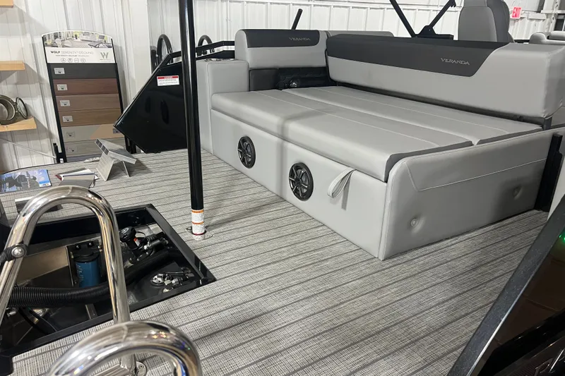 Slide: The Image of 2026 Veranda VR 265 VL boat interior with gray seating and striped flooring. - 5