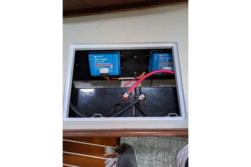 Slide: The Image of Battery compartment of 1988 Ericson 38-200 sailboat with Victron Orion-Tr Smart chargers. - 16
