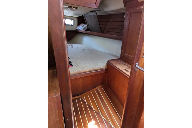 Slide: The Image of Cozy cabin interior of 1988 Ericson 38-200 sailboat with wooden finish. - 33