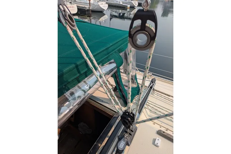 Slide: The Image of Rope rigging on 1988 Ericson 38-200 sailboat, docked with green canopy. - 26