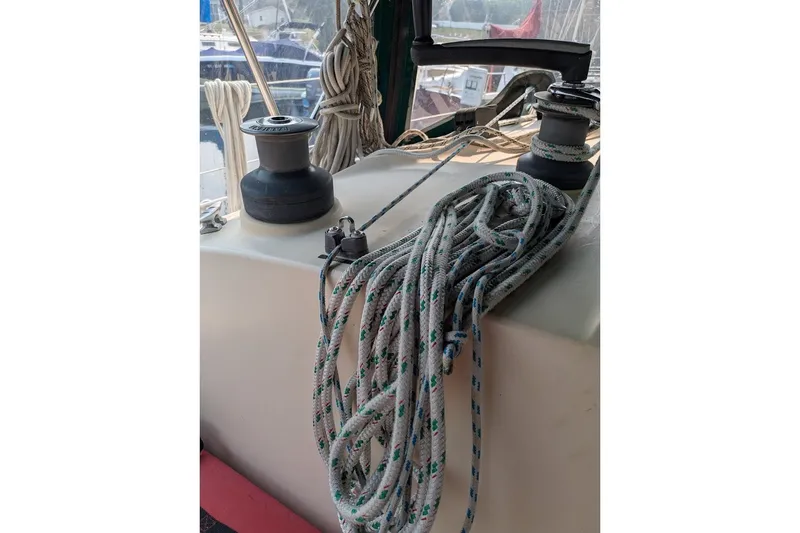 Slide: The Image of Winch and ropes on 1988 Ericson 38-200 sailboat deck, docked at marina. - 30