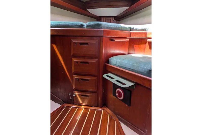 Slide: The Image of Interior of 1988 Ericson 38-200 sailboat with wooden cabinetry and cushioned seating. - 43