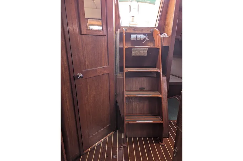 Slide: The Image of Interior of 1988 Ericson 38-200 sailboat with wooden stairs and door. - 23