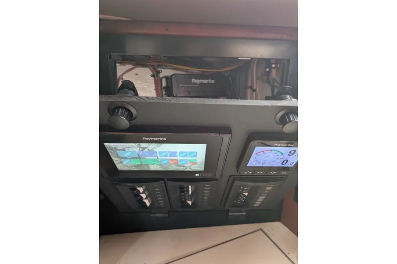 Slide: The Image of Control panel of a 1988 Ericson 38-200 sailboat with Raymarine displays. - 21