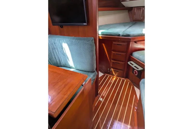 Slide: The Image of Interior of 1988 Ericson 38-200 sailboat with wood finish and cozy seating area. - 40