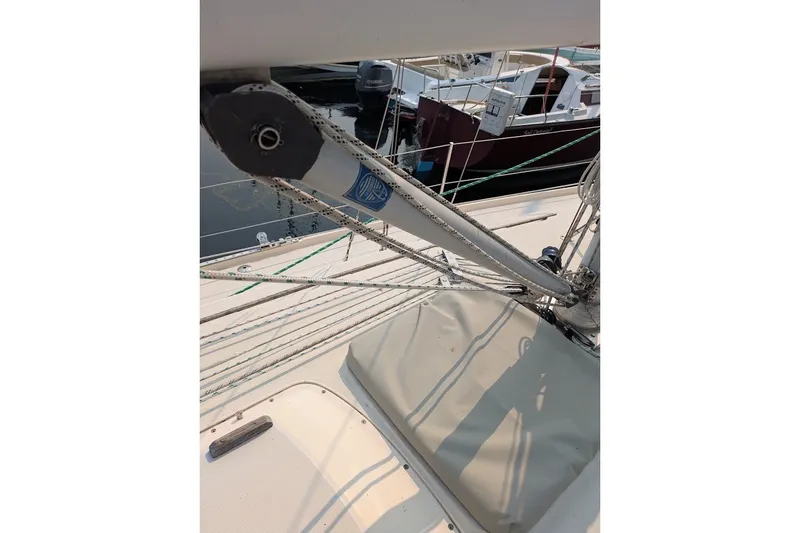 Slide: The Image of 1988 Ericson 38-200 sailboat deck with rigging and ropes in marina. - 27