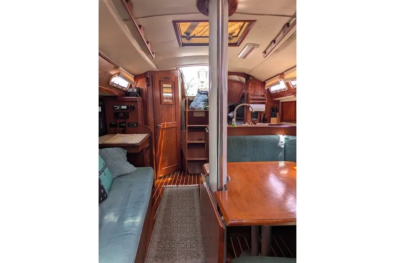 Slide: The Image of Interior of 1988 Ericson 38-200 sailboat with wood finishes and seating area. - 48