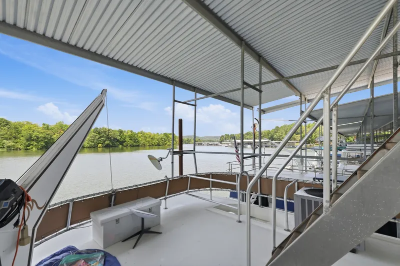 Slide: The Image of Upper deck of 2002 Monticello 16x70 houseboat with river view and canopy. - 14