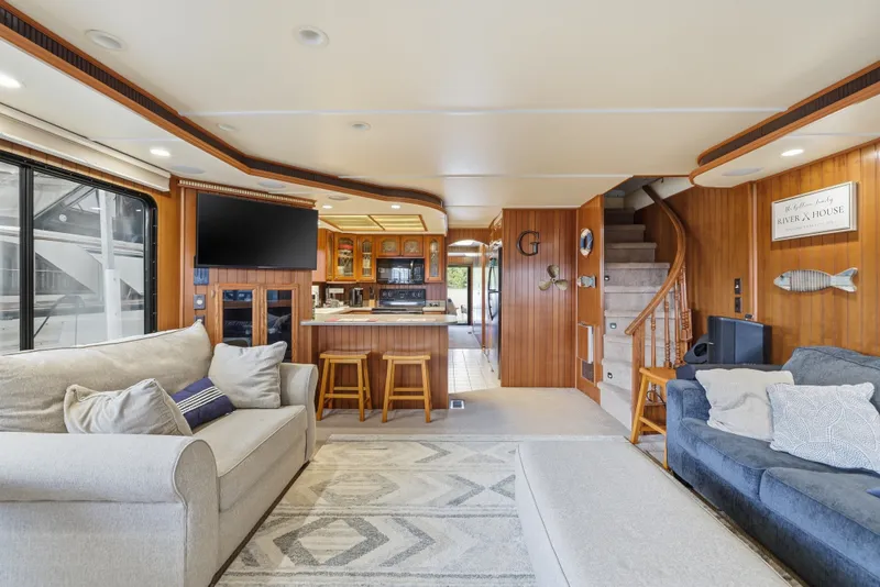 Slide: The Image of Luxurious 2002 Monticello 16x70 houseboat interior with cozy seating, modern kitchen, and elegant wood paneling. - 36