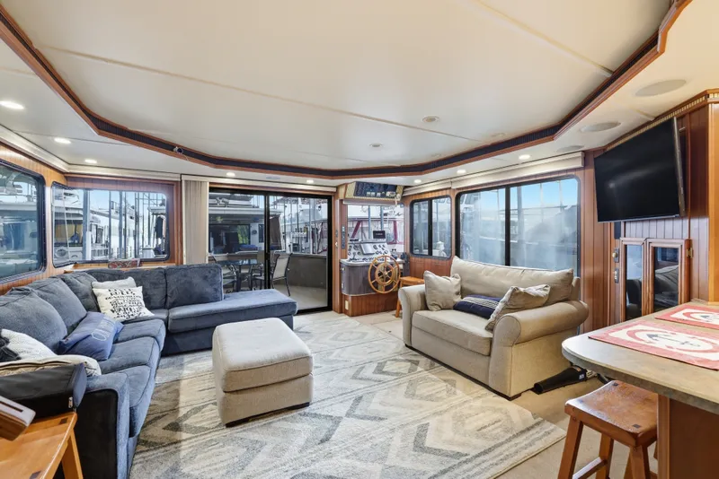 Slide: The Image of Luxurious Monticello 16x70 houseboat interior, featuring cozy seating and modern amenities, 2002 model. - 30