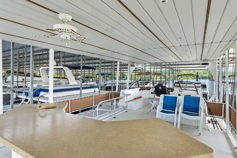 Slide: The Image of Houseboat interior with seating and bar area, Monticello 16x70, 2002 model, docked in marina. - 20