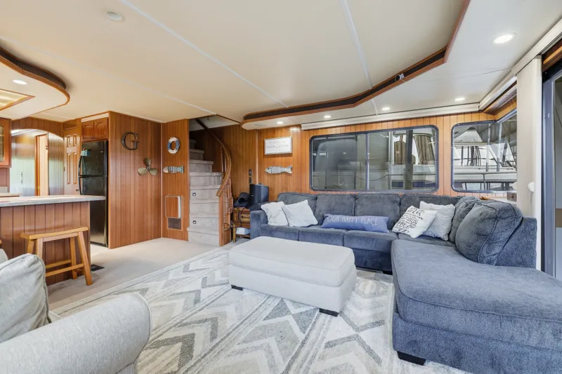 Slide: The Image of Luxurious 2002 Monticello 16x70 houseboat interior with cozy seating and modern kitchen. - 24