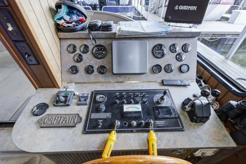 Slide: The Image of Control panel of a 2002 Monticello 16x70 boat with gauges and navigation equipment. - 27