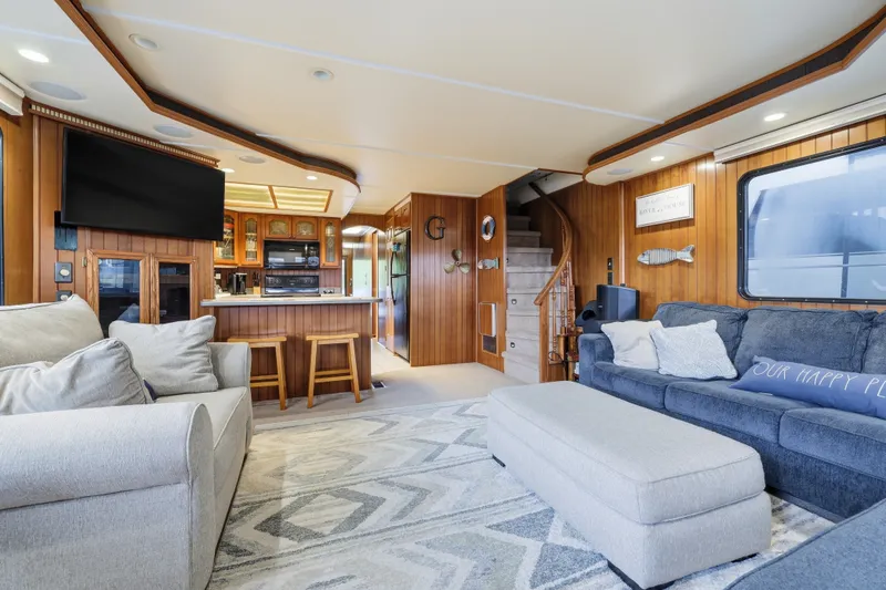 Slide: The Image of Luxurious 2002 Monticello 16x70 houseboat interior with modern living area and kitchen. - 23
