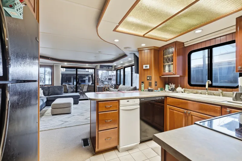 Slide: The Image of Luxurious 2002 Monticello 16x70 houseboat kitchen with modern appliances and cozy living area. - 48