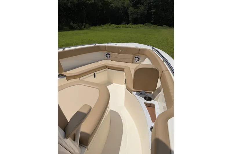 Slide: The Image of 2020 Scout 235 XSF boat interior with tan seating and cup holders. - 18