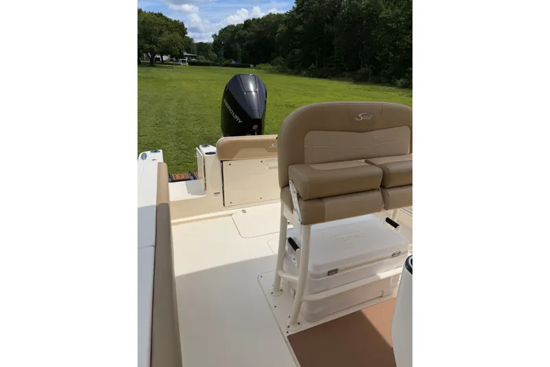 Slide: The Image of 2020 Scout 235 XSF boat interior with seating and Mercury outboard motor. - 19
