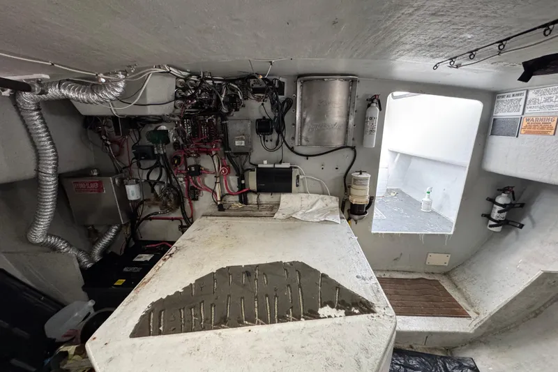 Slide: The Image of Engine room of a 2007 Northern Bay 36 boat, showcasing wiring and equipment. - 34