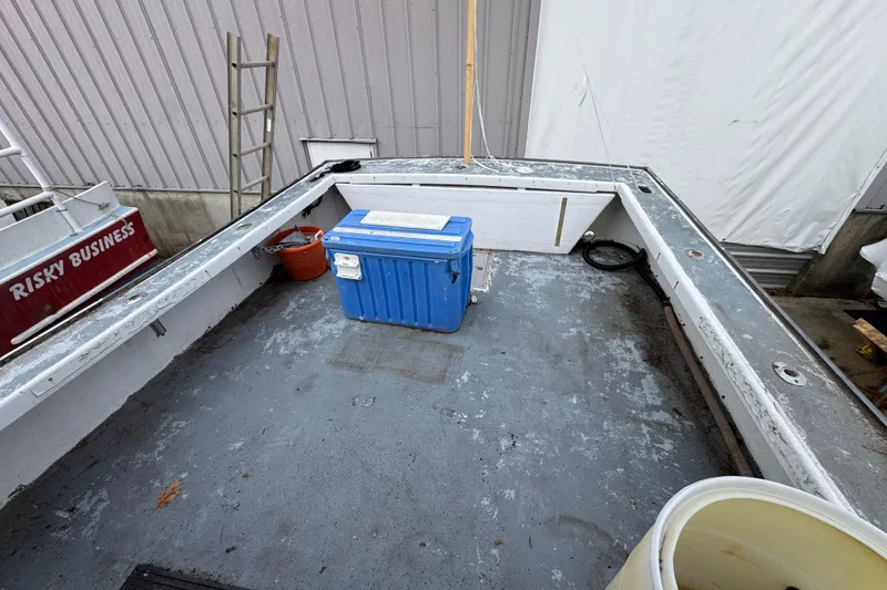 Slide: The Image of Open deck of a 2007 Northern Bay 36 boat with a blue cooler. - 13