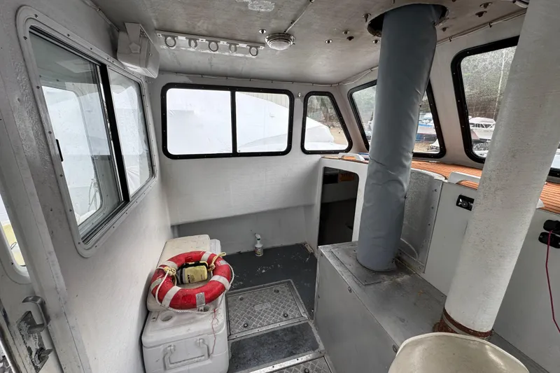 Slide: The Image of Interior of a 2007 Northern Bay 36 boat with windows and safety equipment. - 26