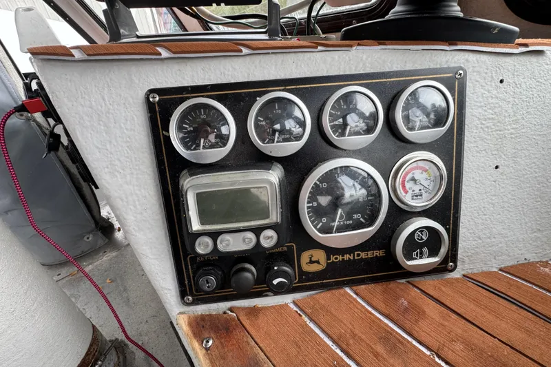 Slide: The Image of Control panel of a 2007 Northern Bay 36 boat with John Deere gauges. - 23