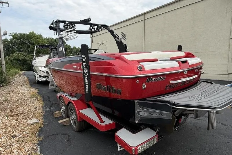 Slide: The Image of 2016 Malibu Wakesetter 25 LSV in vibrant red, parked on a trailer. - 1
