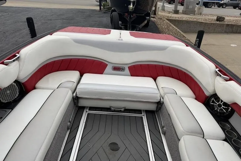 Slide: The Image of 2016 Malibu Wakesetter 25 LSV boat interior with red and white seating. - 3