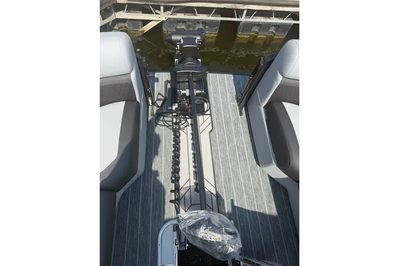 Slide: The Image of Premier 250 Sunsation 2027 boat interior with seating and equipment, docked by the water. - 12