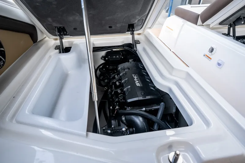 Slide: The Image of 2023 Yamaha Boats 275SE engine compartment showcasing powerful engine and sleek design. - 34