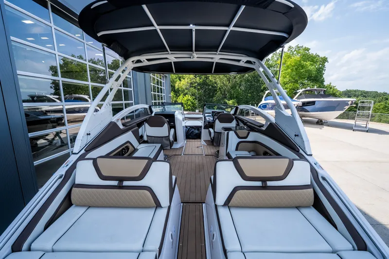 Slide: The Image of 2023 Yamaha Boats 275SE interior with luxurious seating and sleek design. - 8