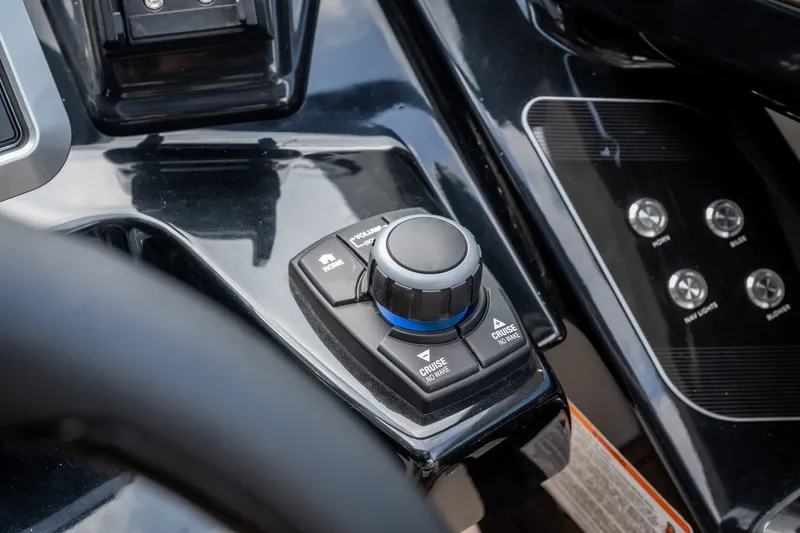 Slide: The Image of Control panel of 2023 Yamaha Boats 275SE, featuring cruise and navigation buttons. - 18