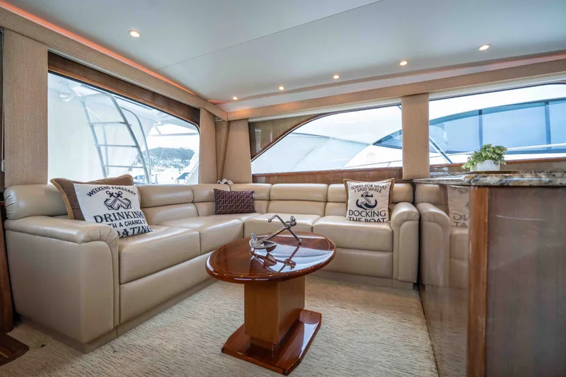 Slide: The Image of Luxurious interior of a 2005 Viking 56 Convertible yacht with plush seating and elegant decor. - 3