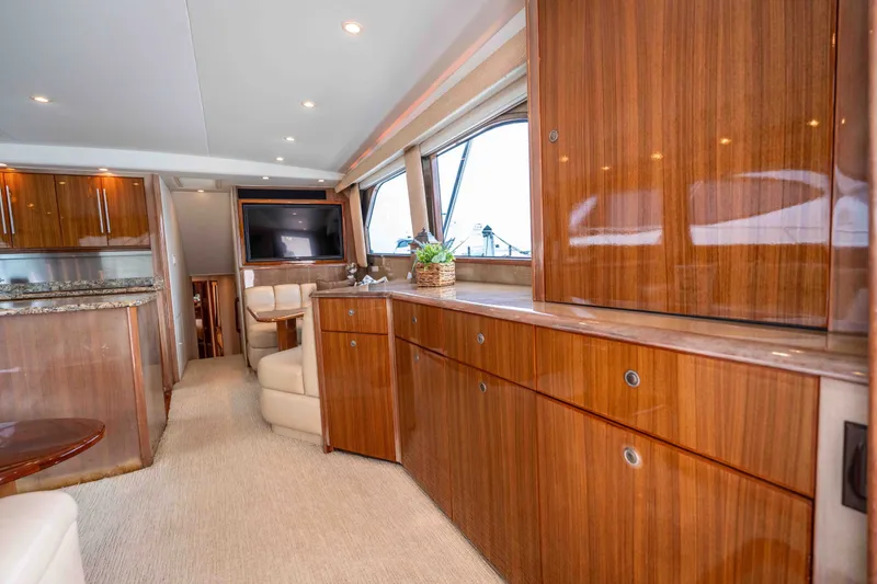 Slide: The Image of Luxurious interior of 2005 Viking 56 Convertible yacht with polished wood cabinetry. - 2