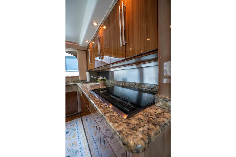 Slide: The Image of Luxurious kitchen interior of 2005 Viking 56 Convertible yacht with granite countertops and modern appliances. - 7