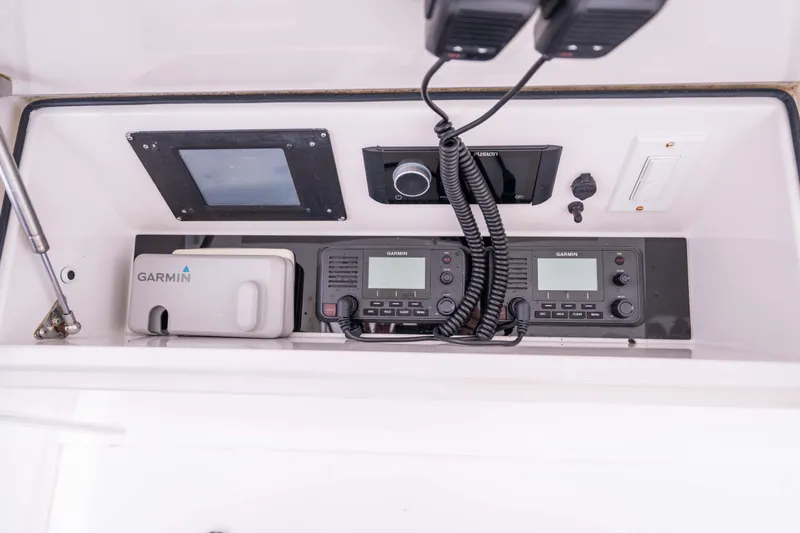 Slide: The Image of Control panel of a 2005 Viking 56 Convertible boat with Garmin electronics. - 30