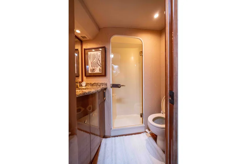 Slide: The Image of Luxurious bathroom in 2005 Viking 56 Convertible yacht with shower and elegant decor. - 15