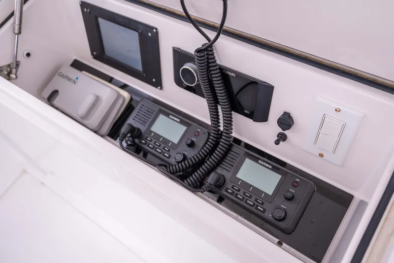 Slide: The Image of 2005 Viking 56 Convertible yacht dashboard with Garmin marine electronics. - 29