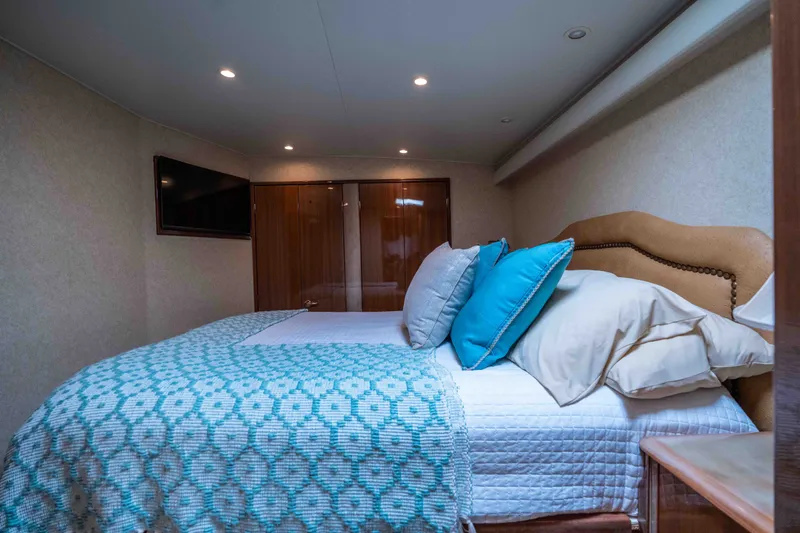 Slide: The Image of Luxurious bedroom interior of 2005 Viking 56 Convertible yacht with elegant bedding and decor. - 14