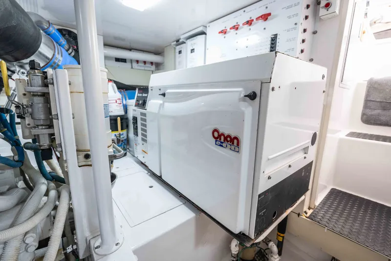 Slide: The Image of Engine room of 2005 Viking 56 Convertible yacht with Onan generator. - 34