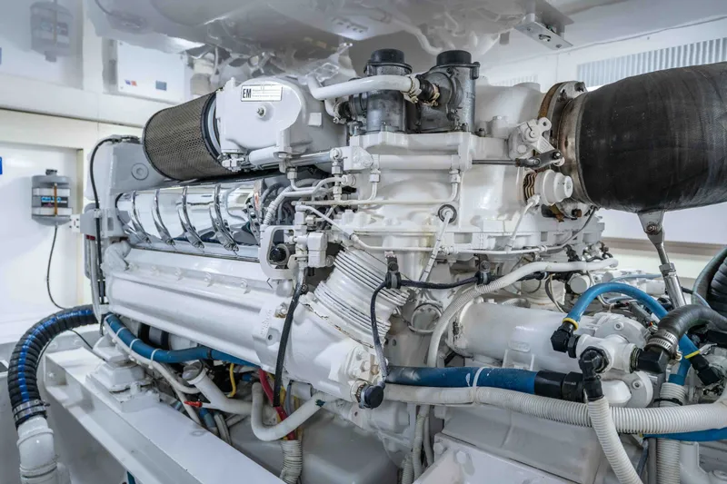 Slide: The Image of Engine room of a 2005 Viking 56 Convertible yacht, showcasing detailed machinery. - 32