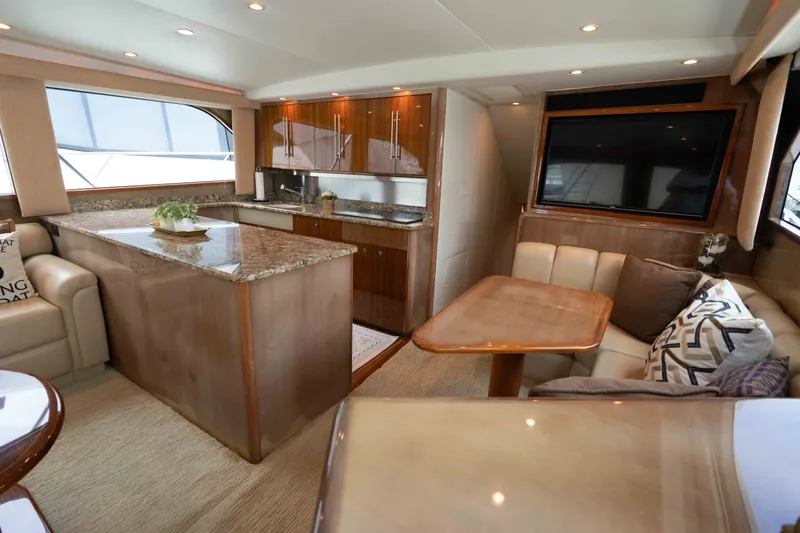 Slide: The Image of Luxurious interior of 2005 Viking 56 Convertible yacht with elegant wood finishes. - 11