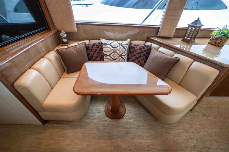 Slide: The Image of Luxurious interior of 2005 Viking 56 Convertible yacht with plush seating and elegant decor. - 8