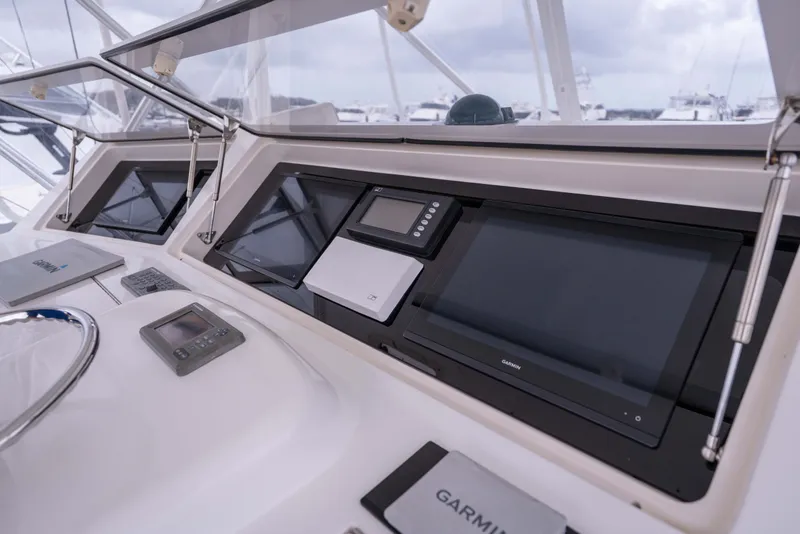 Slide: The Image of Control panel of a 2005 Viking 56 Convertible yacht with Garmin navigation systems. - 25