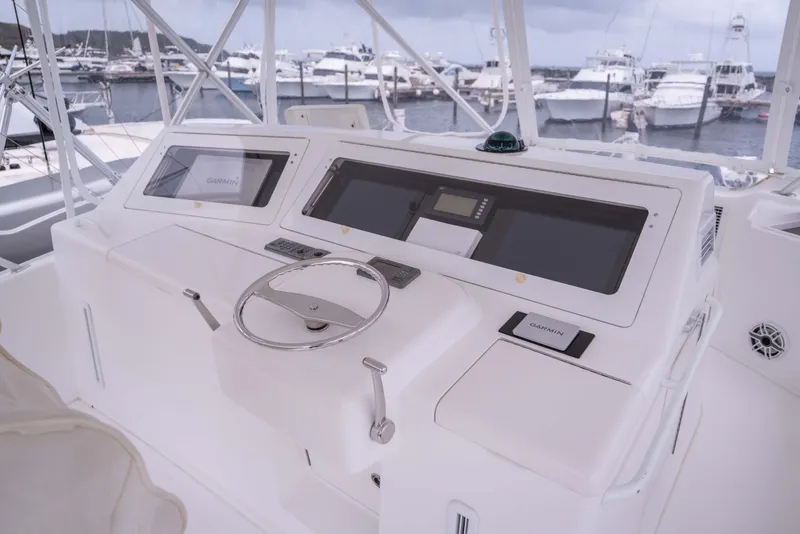 Slide: The Image of Helm of 2005 Viking 56 Convertible yacht with Garmin navigation system. - 21