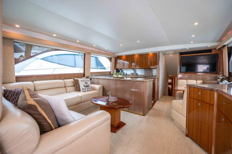 Slide: The Image of Luxurious interior of a 2005 Viking 56 Convertible yacht with elegant seating and modern amenities. - 1
